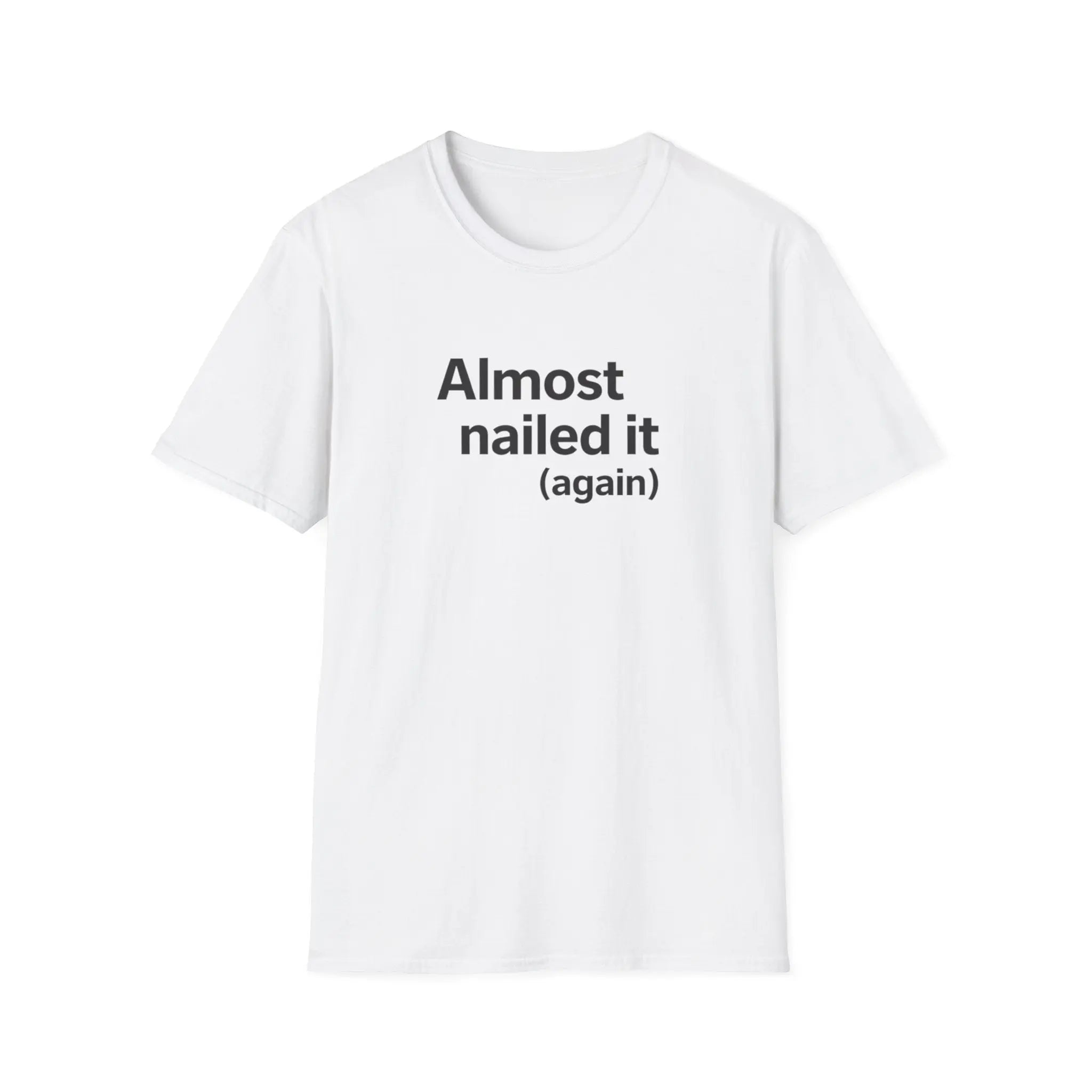 White t-shirt with 'Almost nailed it (again)' text on a white background